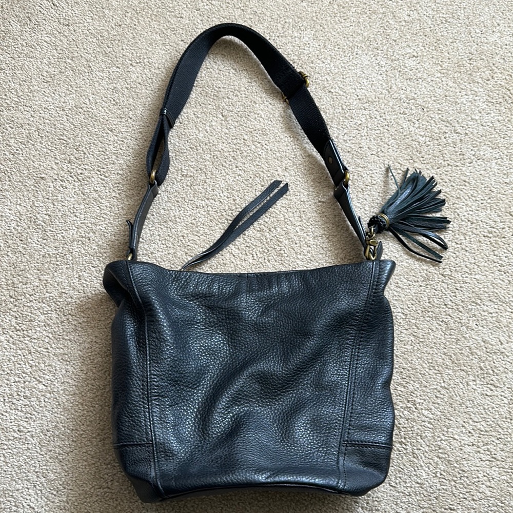 The Sak black leather satchel bag with tassel zip closure and adjustable strap